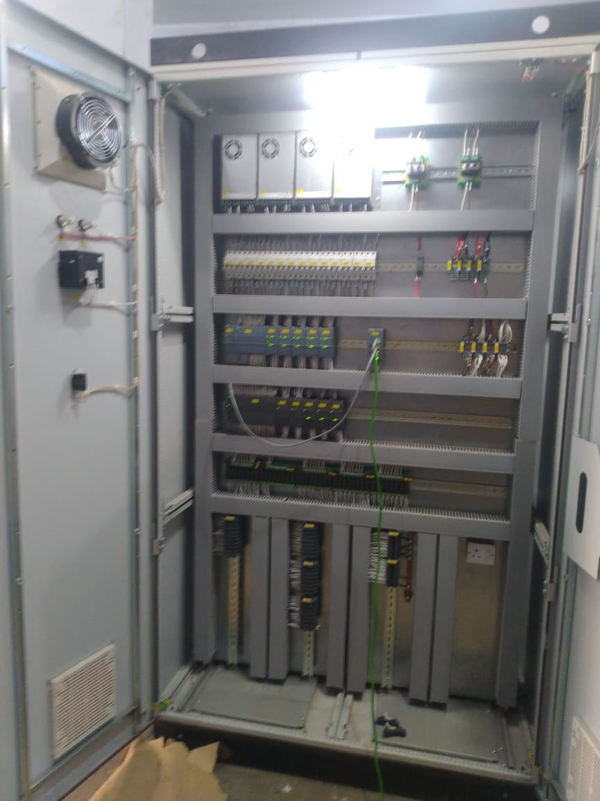 Open PLC panel with PLC rack, power supplies and trunking